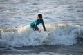 Kovalam, Chennai, Tamilnadu, India - Ã¢â¬Å½Ã¢â¬Å½August 9th Ã¢â¬Å½2021: Young boy Indian surfer surfing and practicing on the beach waves